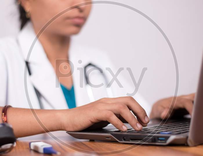 A Doctor using Laptop - A Concept of Doctors Consulting Patients through Video Call