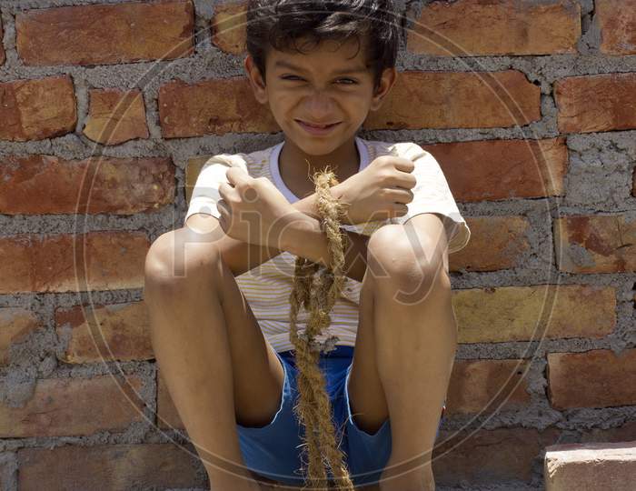 A kid's hands tide with a Rope