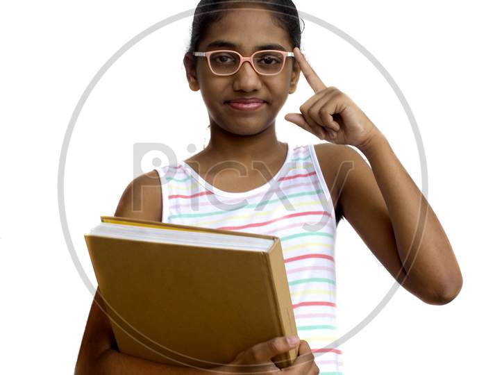 Portrait of a Young Indian Girl with Books in Hand