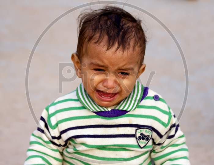 Portrait of a Young Indian Kid with a crying face