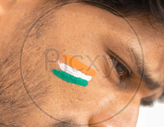 Closeup Of A Tricolor Indian Flag Painted On Face To Cheer India In Cricket Sports.