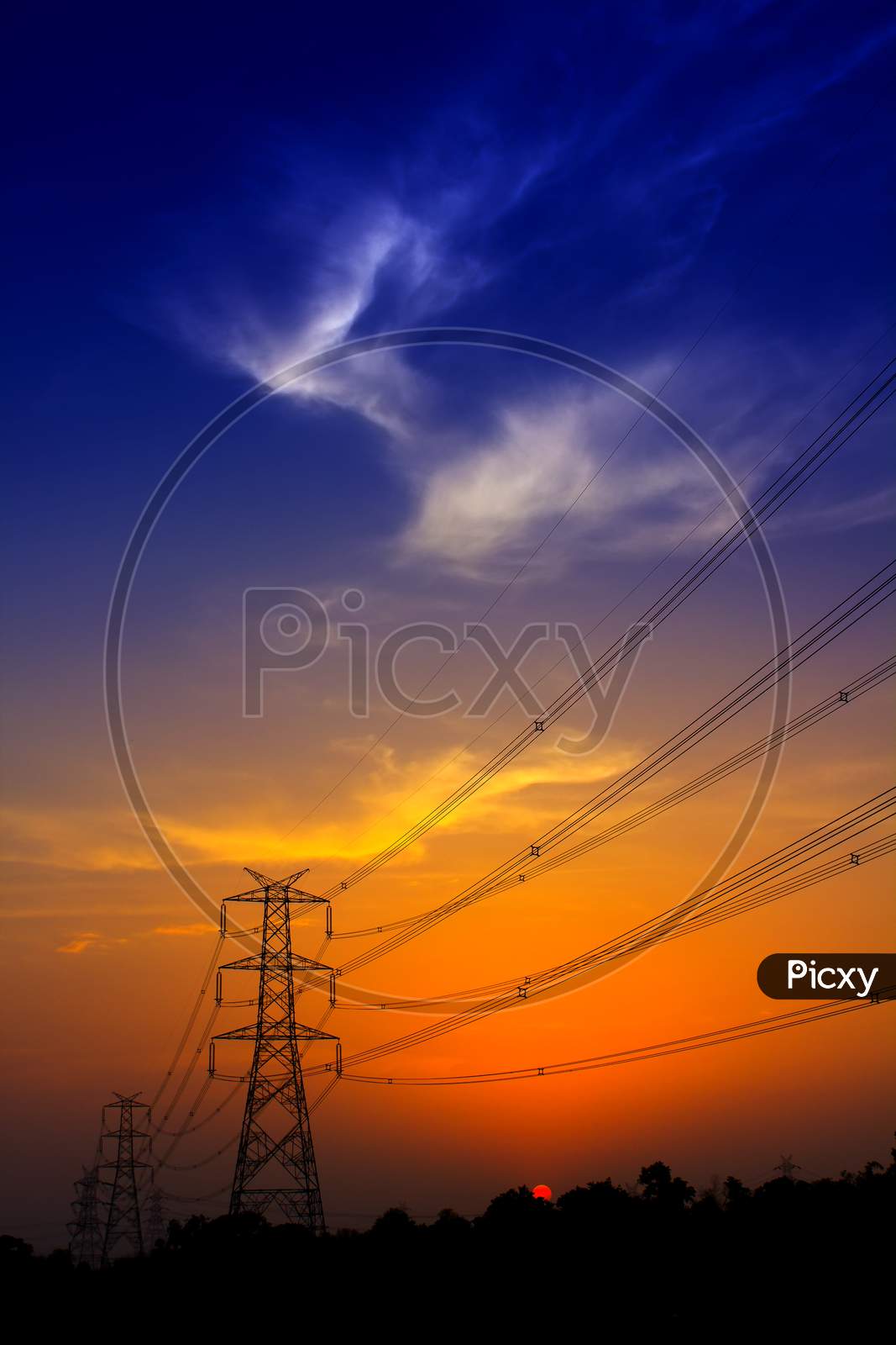 An Electric tower with Clouds in the Background