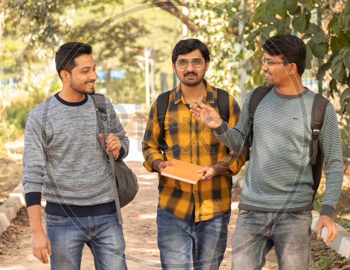 Group Of Happy Young College Students Talking to Each Other At University Campus
