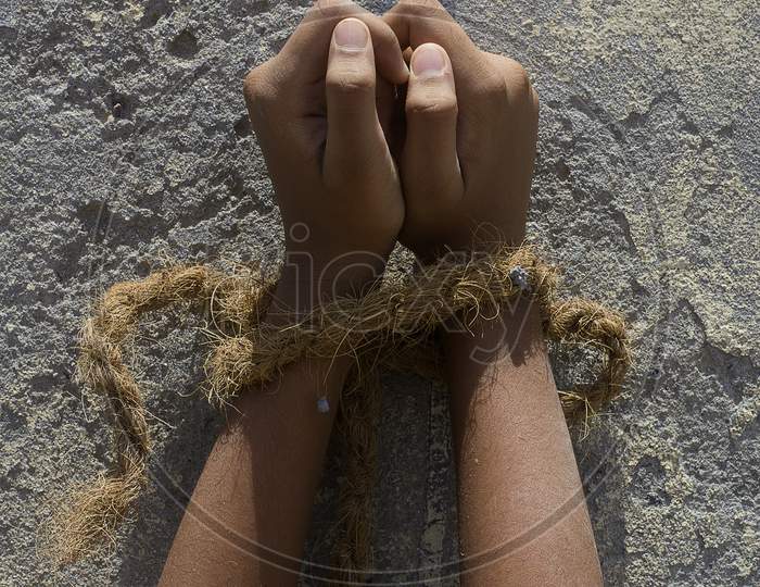 Close up shot of a kid's hands tide with a Rope