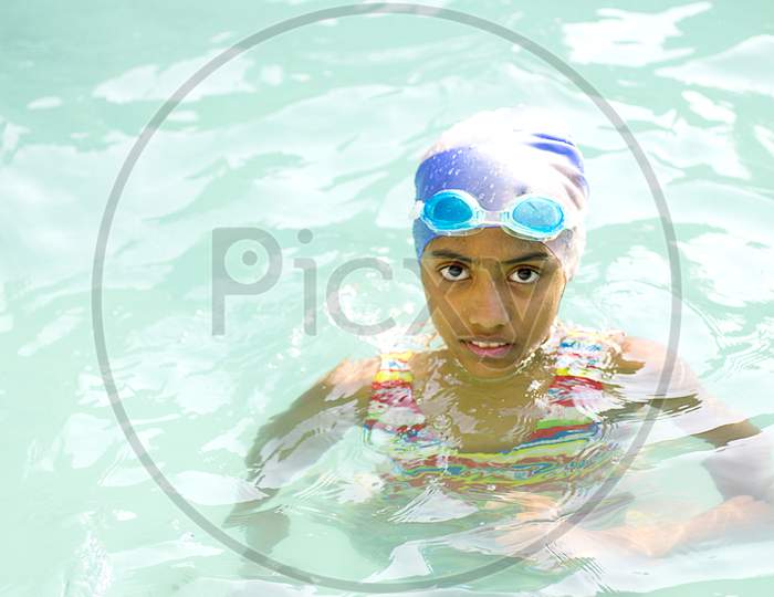 Portrait of a Kid in Swimming Pool