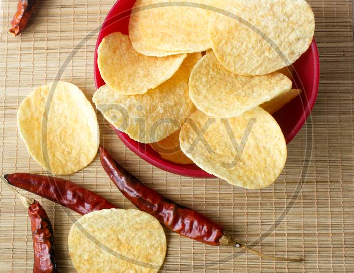 Close up shot of a Potato Chips with Red Chillies