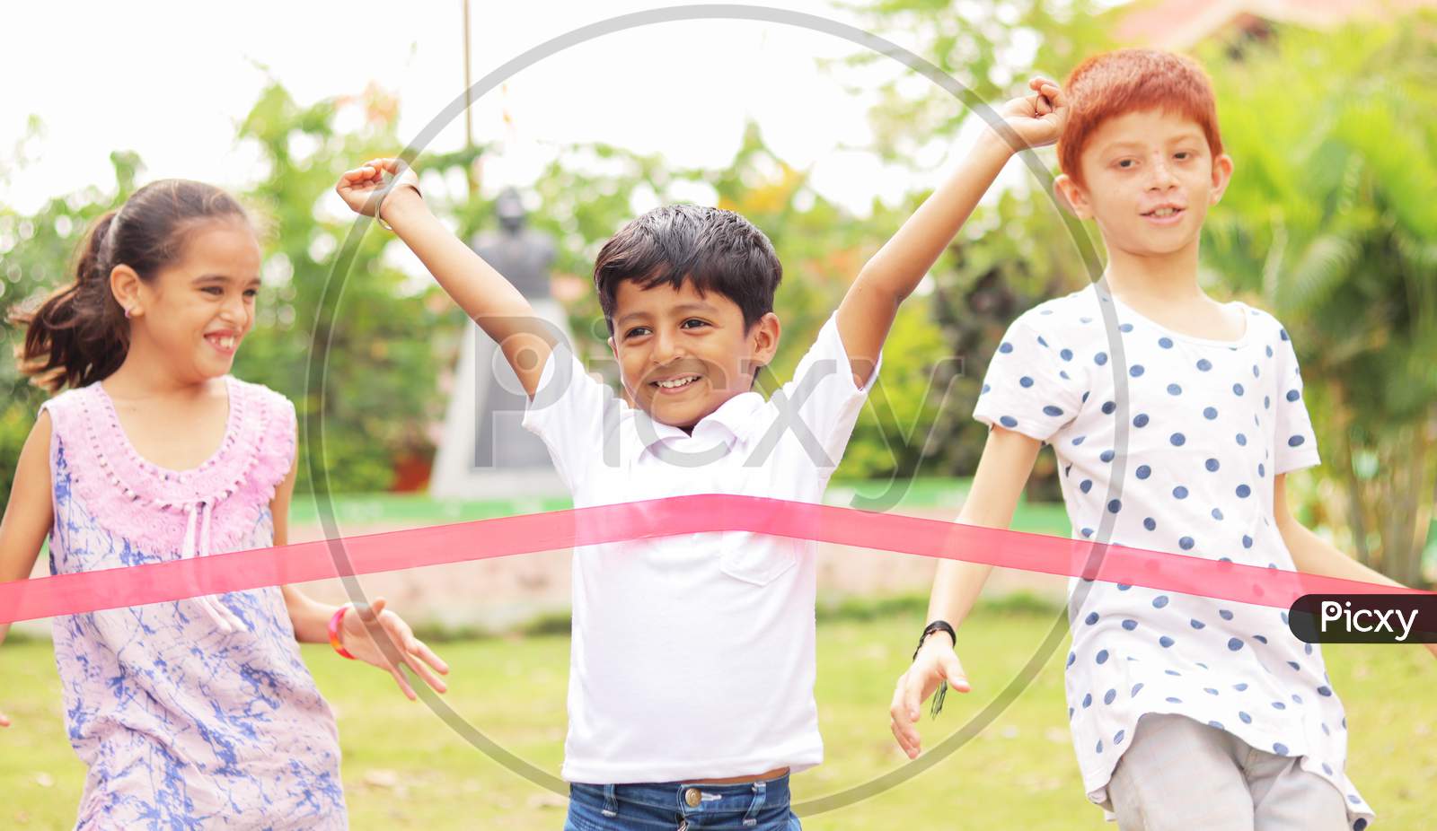 Happy Children Playing Running Race Outdoor Traditional Game - Concept Of Kids Enjoying Outdoor Games In Technology-Driven World.