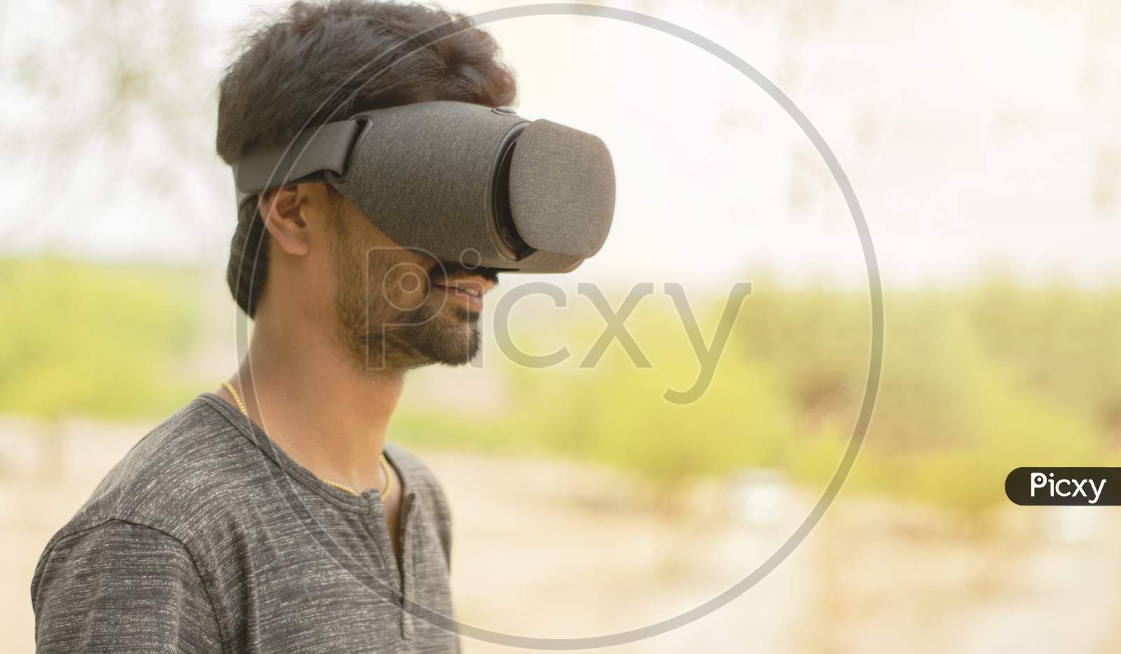 Young Man Using A Vr Headset Glasses Outside