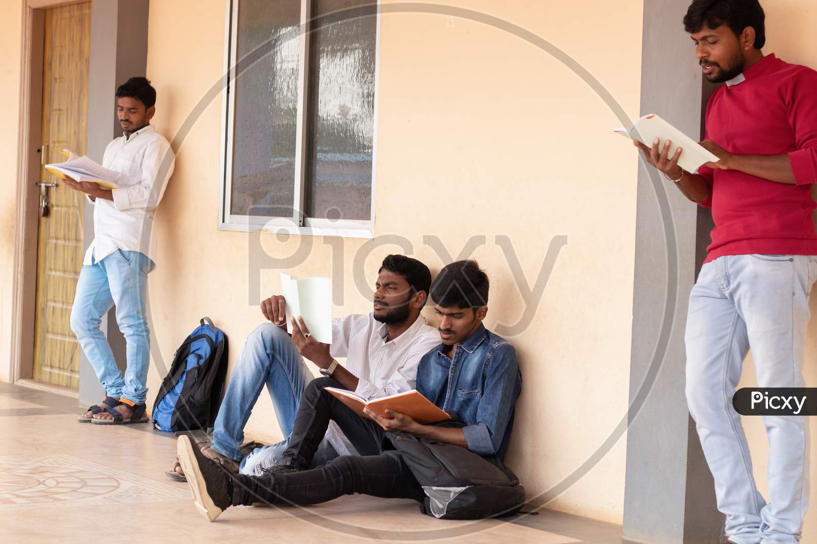 Group Of Students studying by Looking Into Books At College - Education, Learning Student, Education Concept