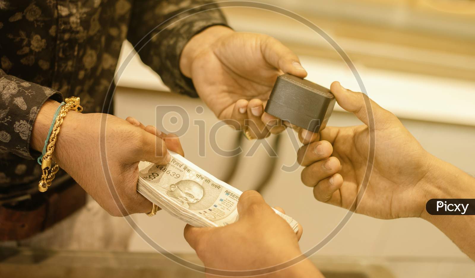 Close Up Of Hands Buying Or Purchasing Gold Jewellery By Paying Indian Currency At Jewelry Shop India - Concept Of Gold Investment For Profit