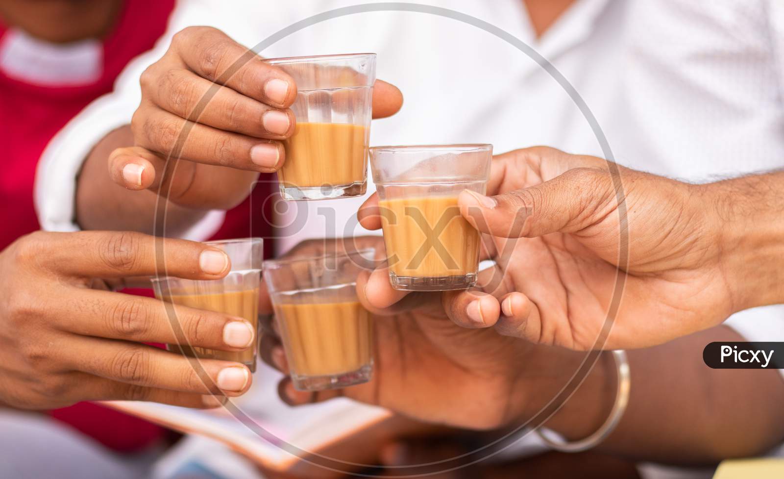Close up shot of People holding Chai Cup