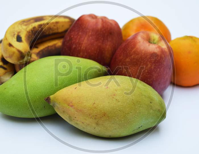 Indian Muskmelon, Oranges, Mango, Banana And Apple.
