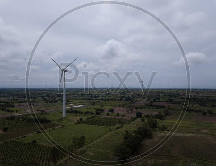 Drone shot of Windmills on a cloudy day