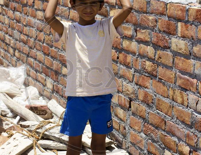 A Kid working at a Construction site