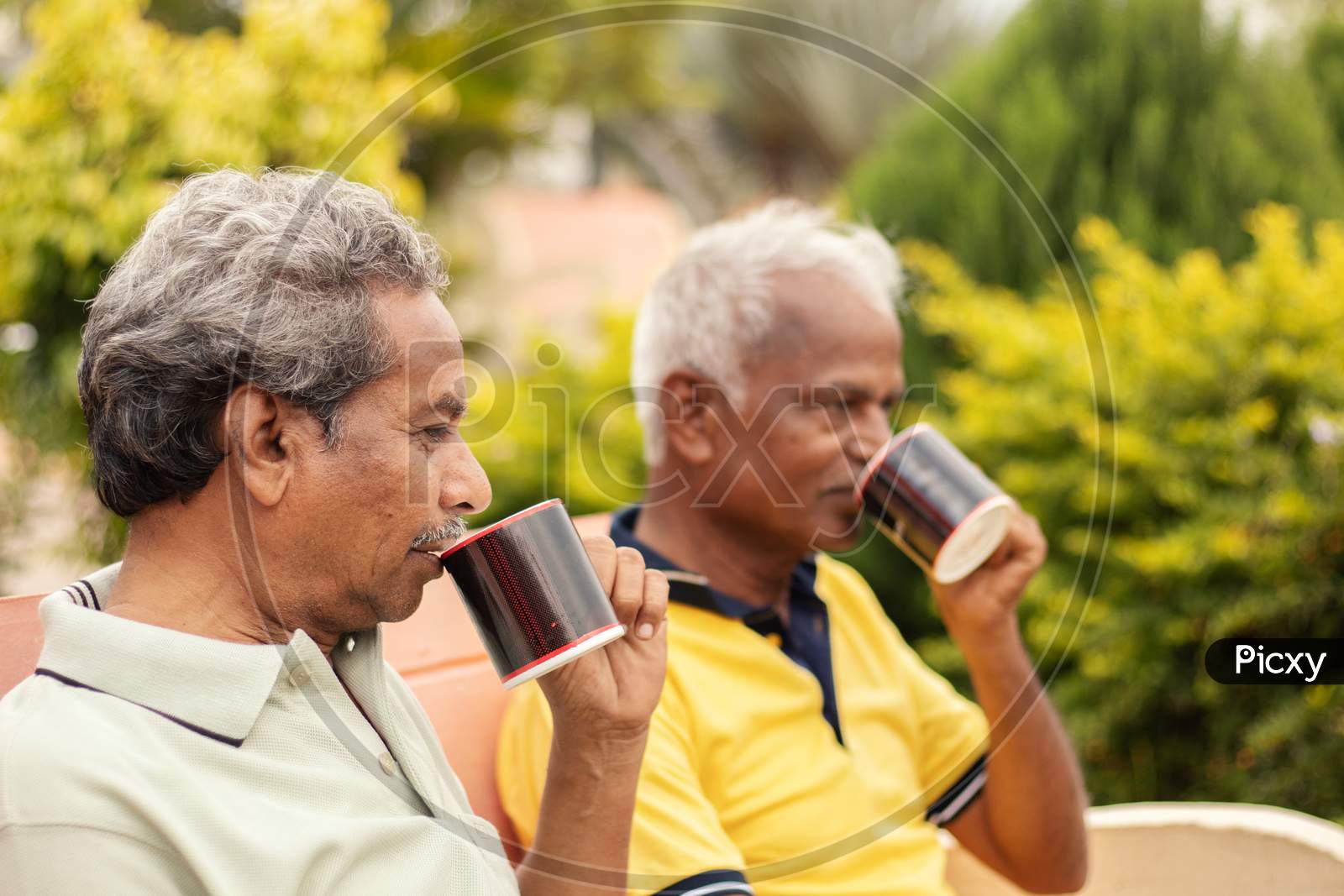 A Couple Of Elderly Man Or Old Men's having Tea or Coffee At Outdoors