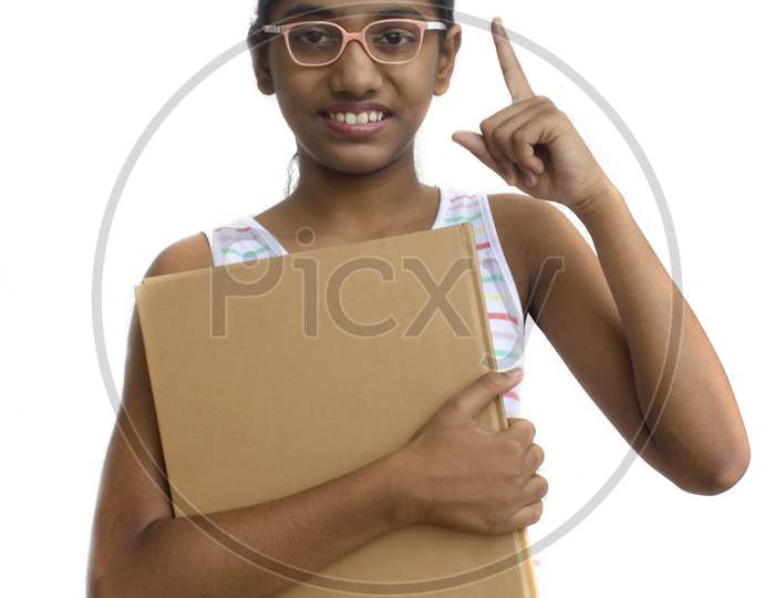 Portrait of a Young Indian Girl with Books in Hand