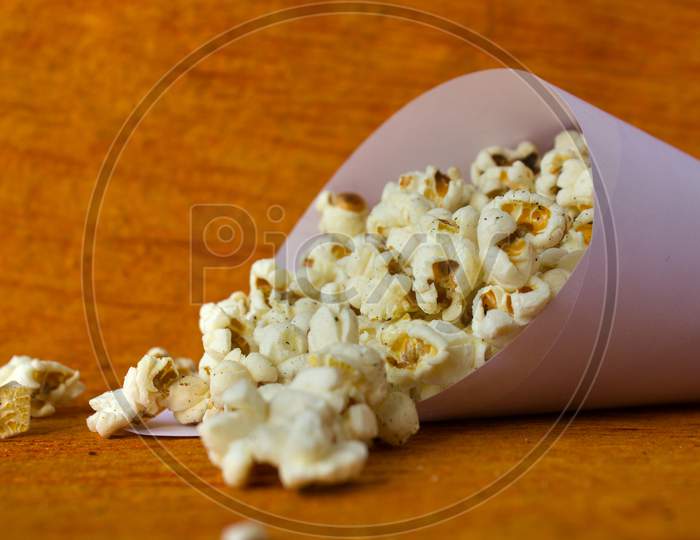 Pop Corns with brown Background