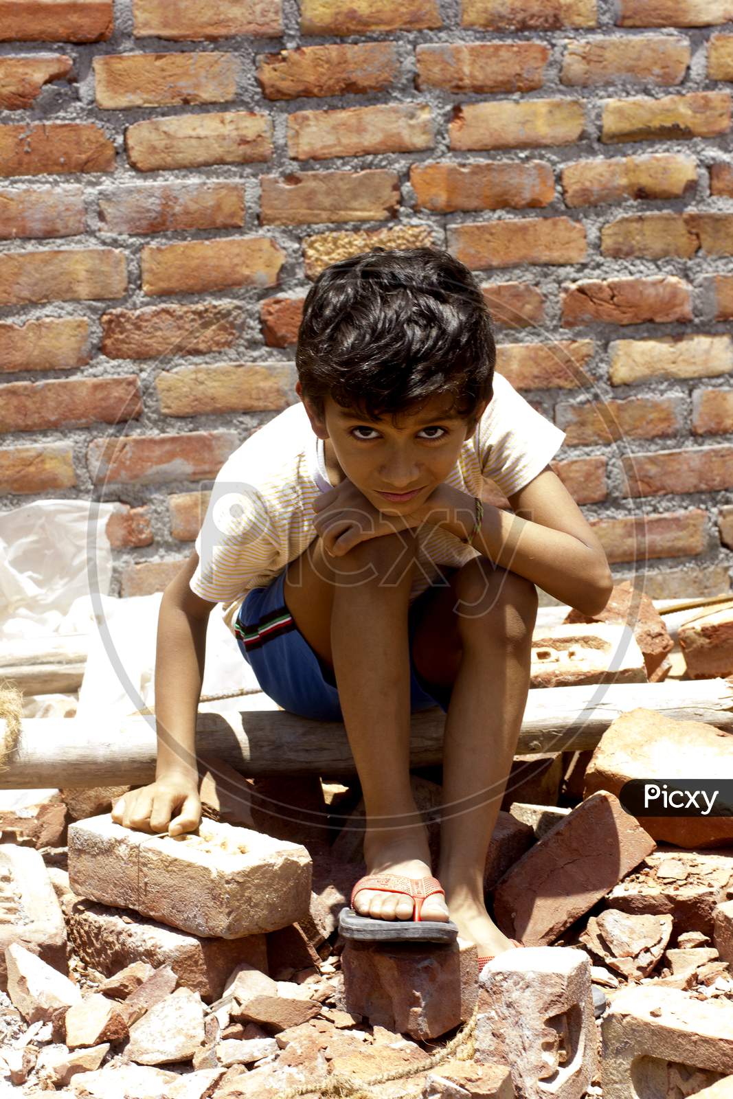 A Kid working at a Construction site