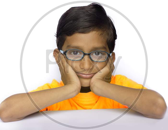 Portrait of a Young Indian Boy with Thinking Expression