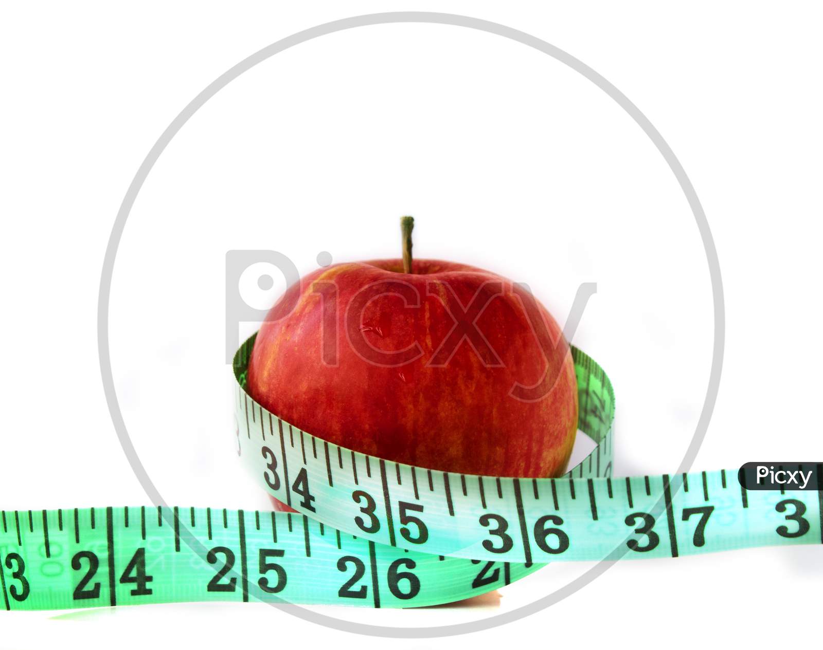 An Apple with measuring Tape on White background