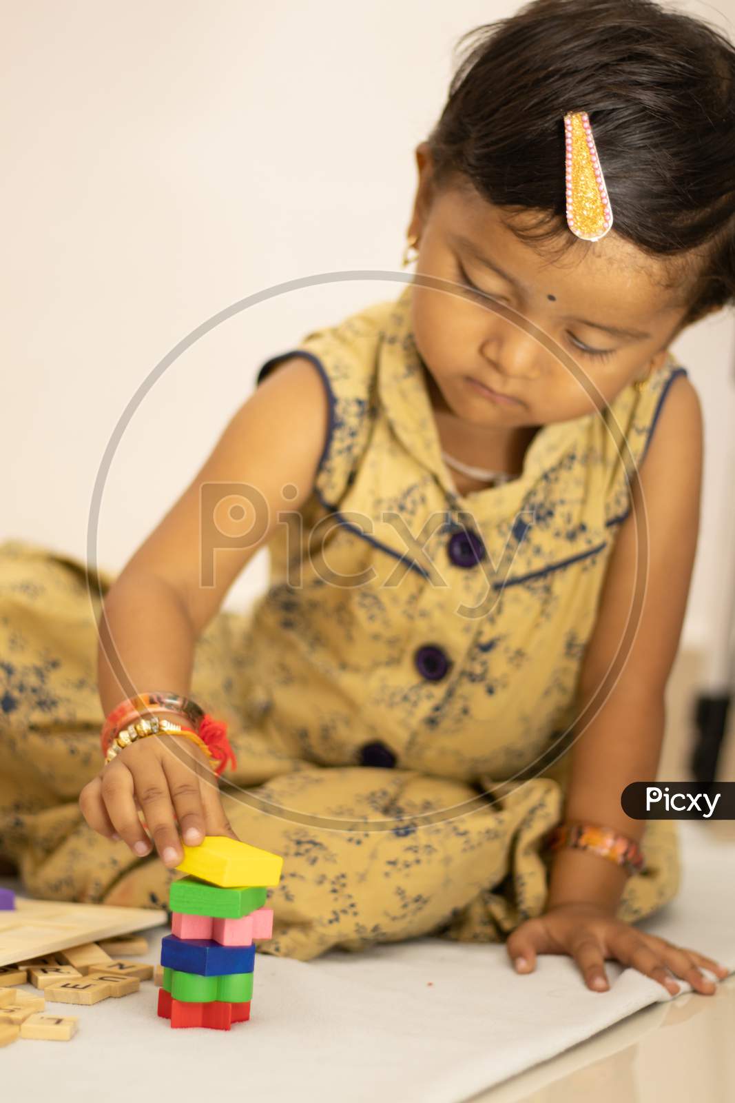 A Kid Playing with Toys