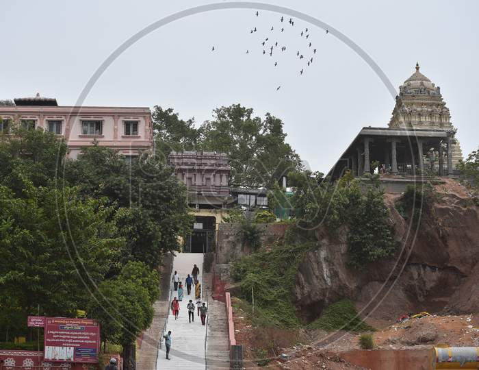 Devotees leave after paying obeisance at Kanaka Durga temple, after it reopened with certain restrictions, during the fifth phase of coronavirus lockdown in Vijayawada.