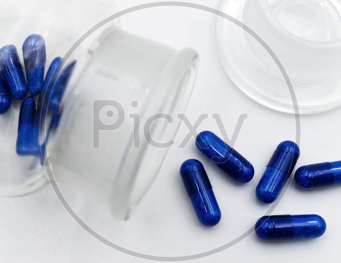 Blue medicine pils isolated on white