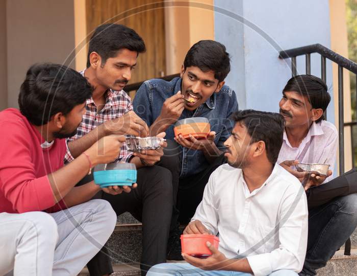 A Group of Young Men's having Lunch together At a University Campus or College Campus