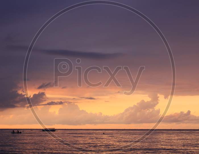 Boat On Colored Sea And Ocean At Sunset On Lovina