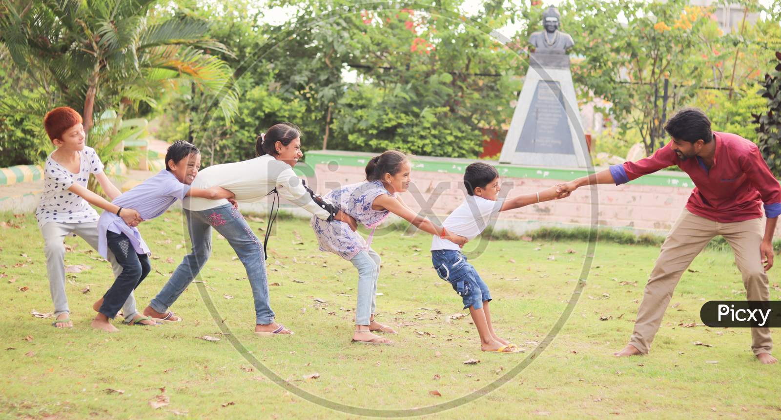 Children's Playing Traditional Games At a Park, Outdoors - Concept Of Kids Enjoying Outdoor Games In Technology-Driven World.