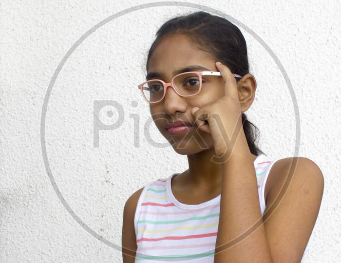 Portrait of a Young Indian Girl with Thinking Expression