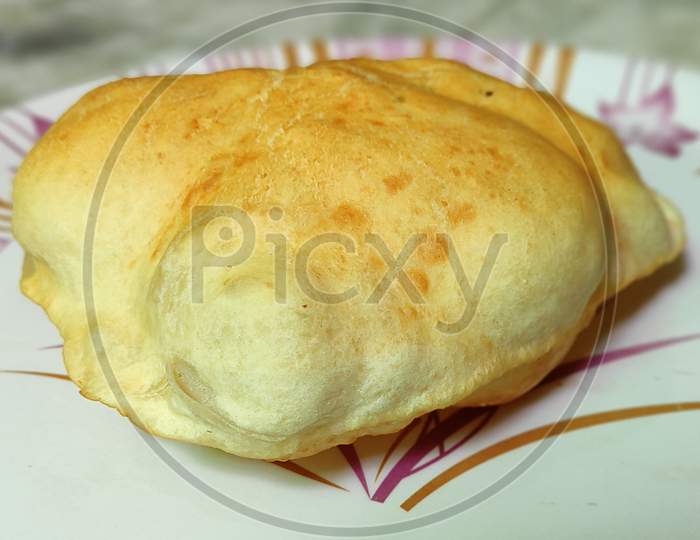 Homemade bhatura in plate , singlee bhatura