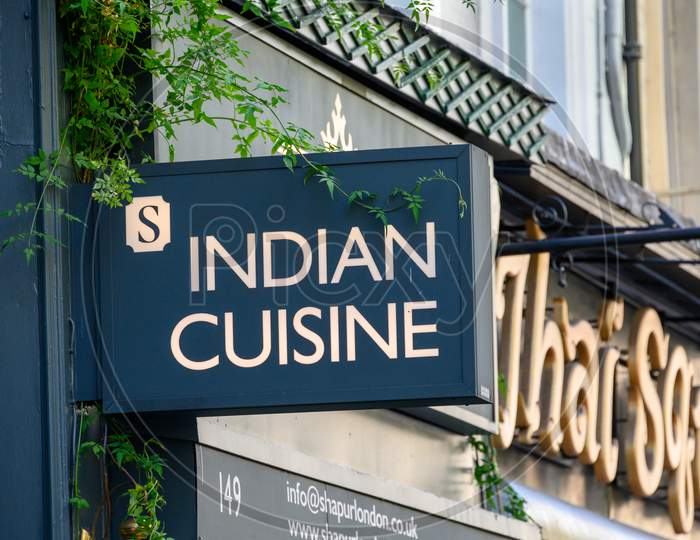 Sign Above An Indian Restaurant On The Strand, London