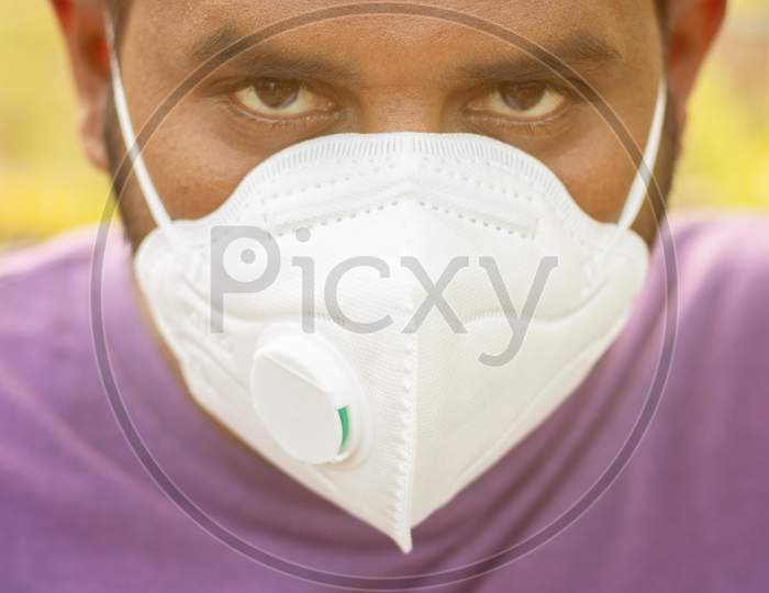 Close up Young Man Properly Covered Nose And Mouth With Face Mask - Awareness And Safety Concept To Ware Mask Properly, To Protect From Coronavirus Or Covid-19