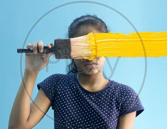 Portrait of a Young Indian Girl with a Paint Brush