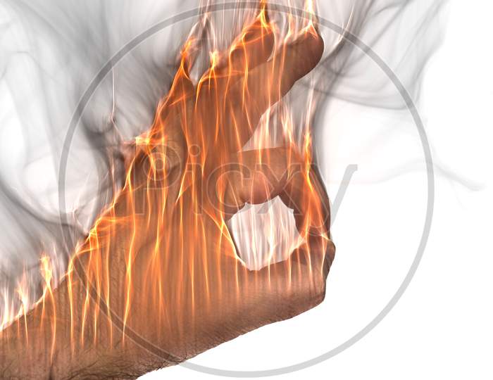 A Human Hand On Fire Burning With Orange Flames And Some Smoke In Front Of A Bright Background