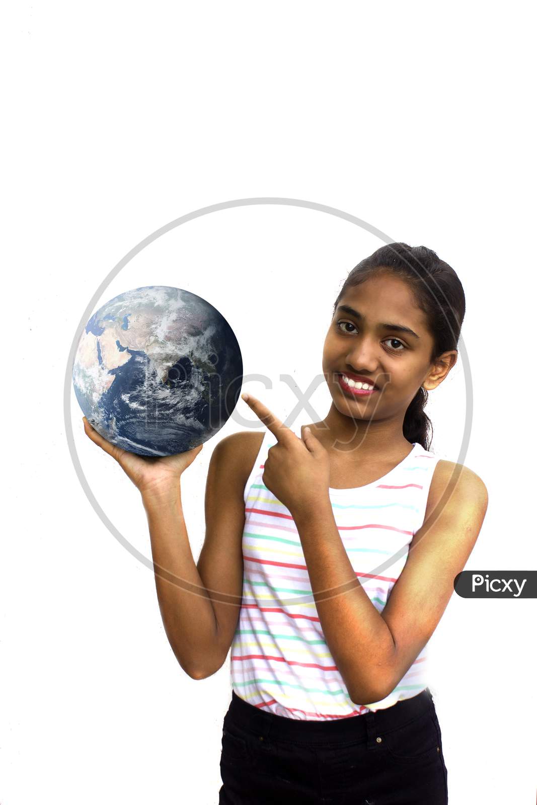 Portrait of a Young Indian School Girl pointing towards A Globe