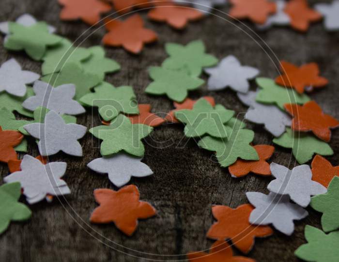 Coloured paper Arts on Wooden Background