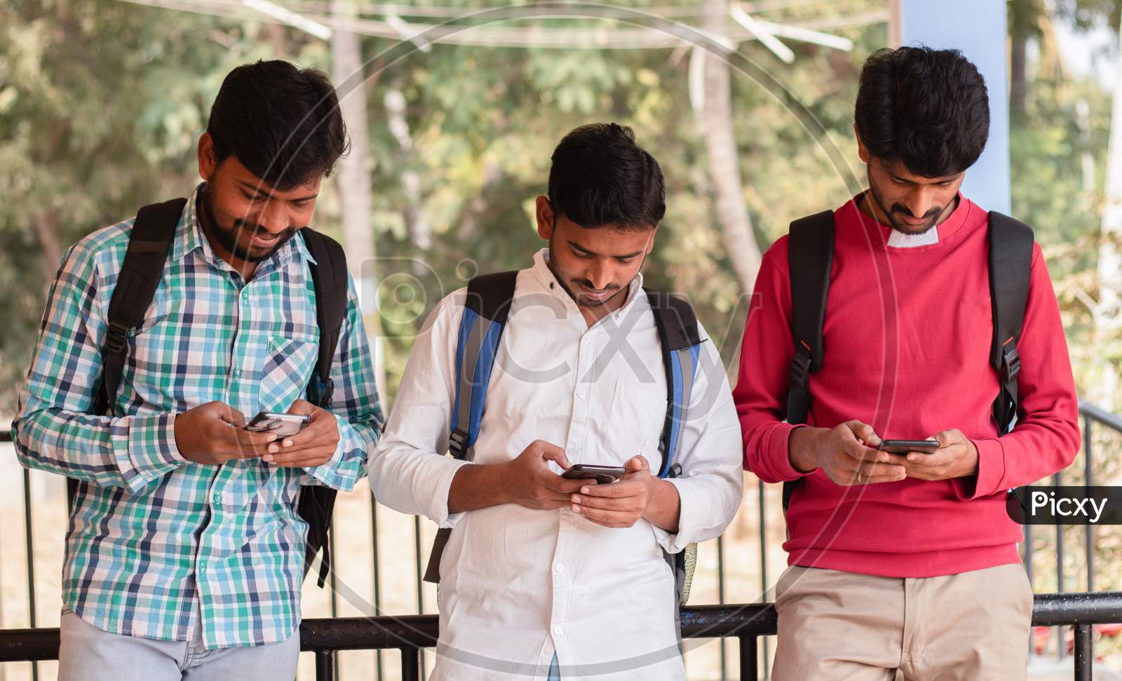 Image Of Group Of College Students Using Mobile Phones Or Smartphones ...