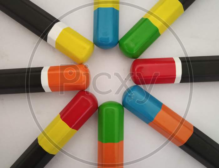 Black colourful pencils on white background