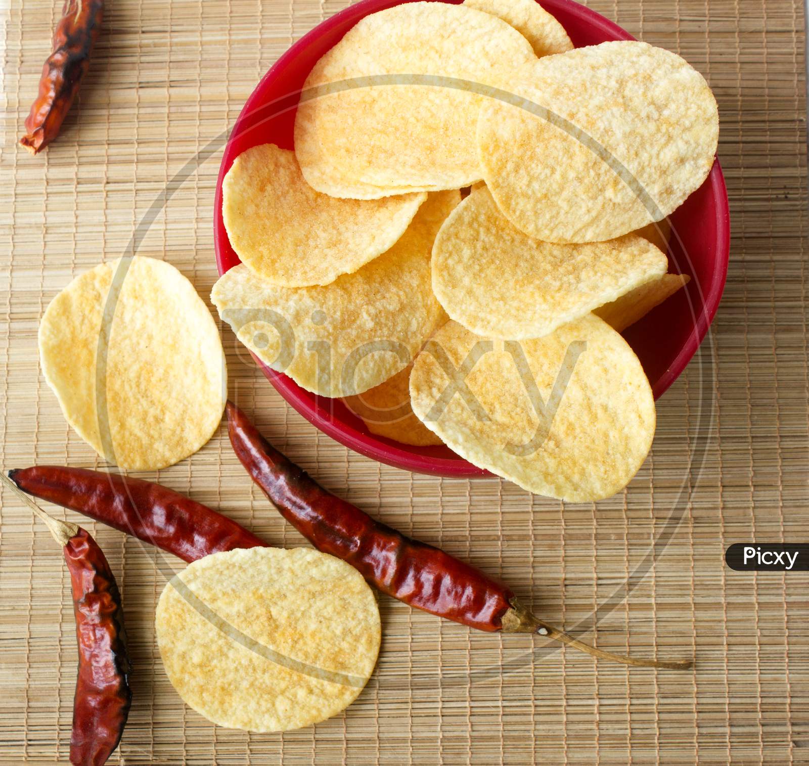 Close up shot of a Potato Chips with Red Chillies