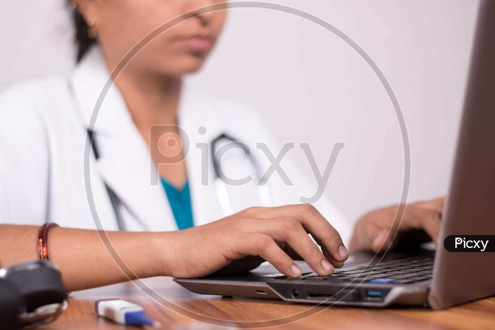A Doctor using Laptop - A Concept of Doctors Consulting Patients through Video Call