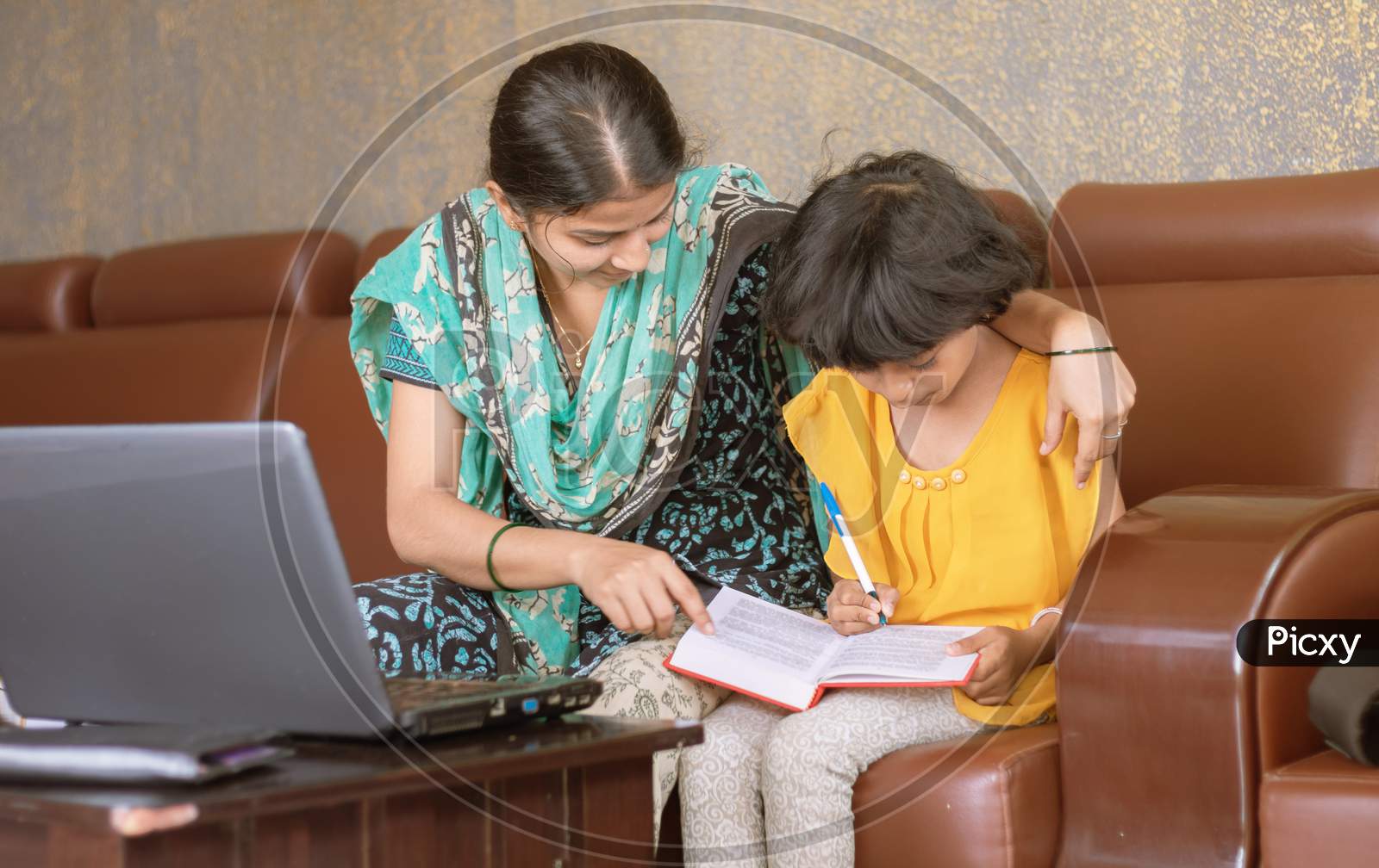 Young Mother Teaching Her Child While Working On Laptop - Concept Of People Lifestyles And Technology, Work Form Home Or Wfh Reality
