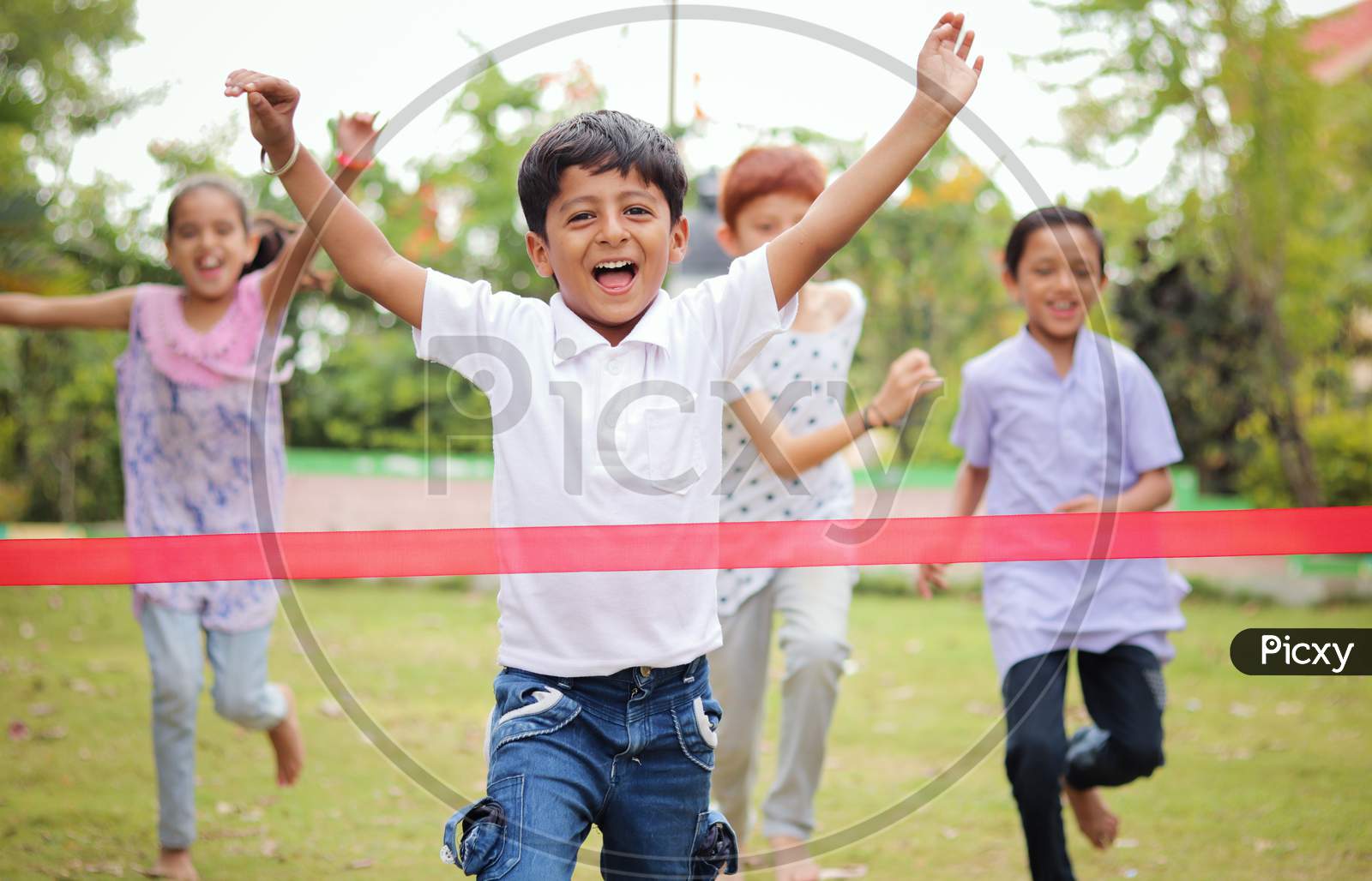 Happy Children Playing Running Race Outdoor Traditional Game - Concept Of Kids Enjoying Outdoor Games In Technology-Driven World.