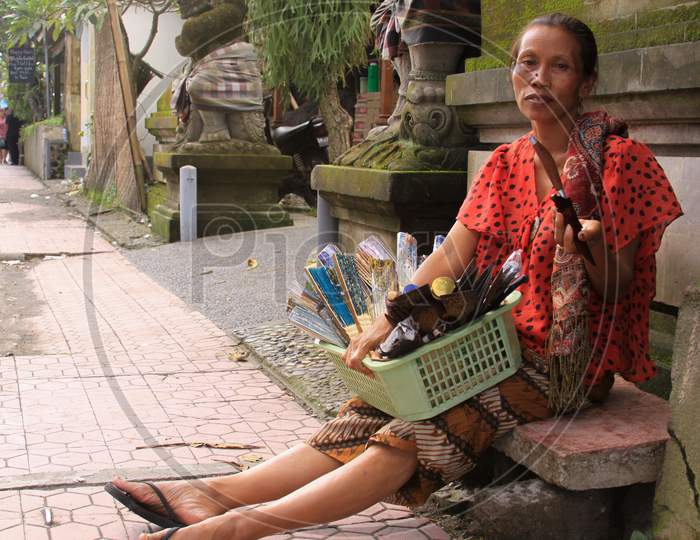 Local Woman Selling Objects In Denpasar Street