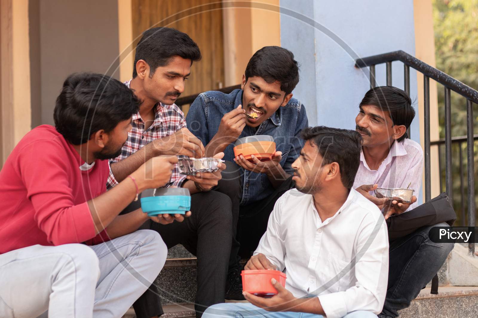 A Group of Young Men's having Lunch together At a University Campus or College Campus