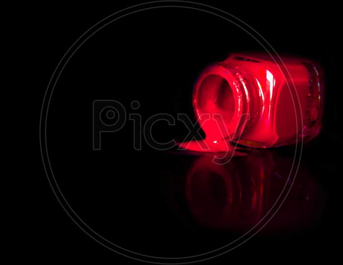 Selective Focus on Red Colour Paint with Black Background