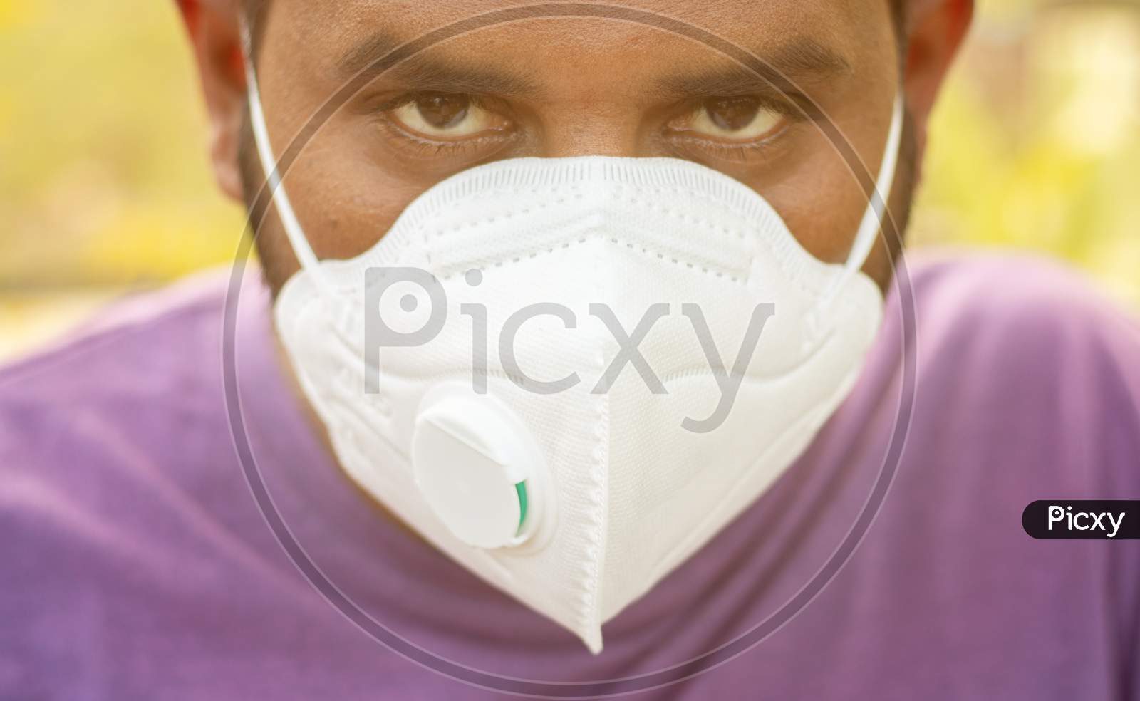 Close up Young Man Properly Covered Nose And Mouth With Face Mask - Awareness And Safety Concept To Ware Mask Properly, To Protect From Coronavirus Or Covid-19