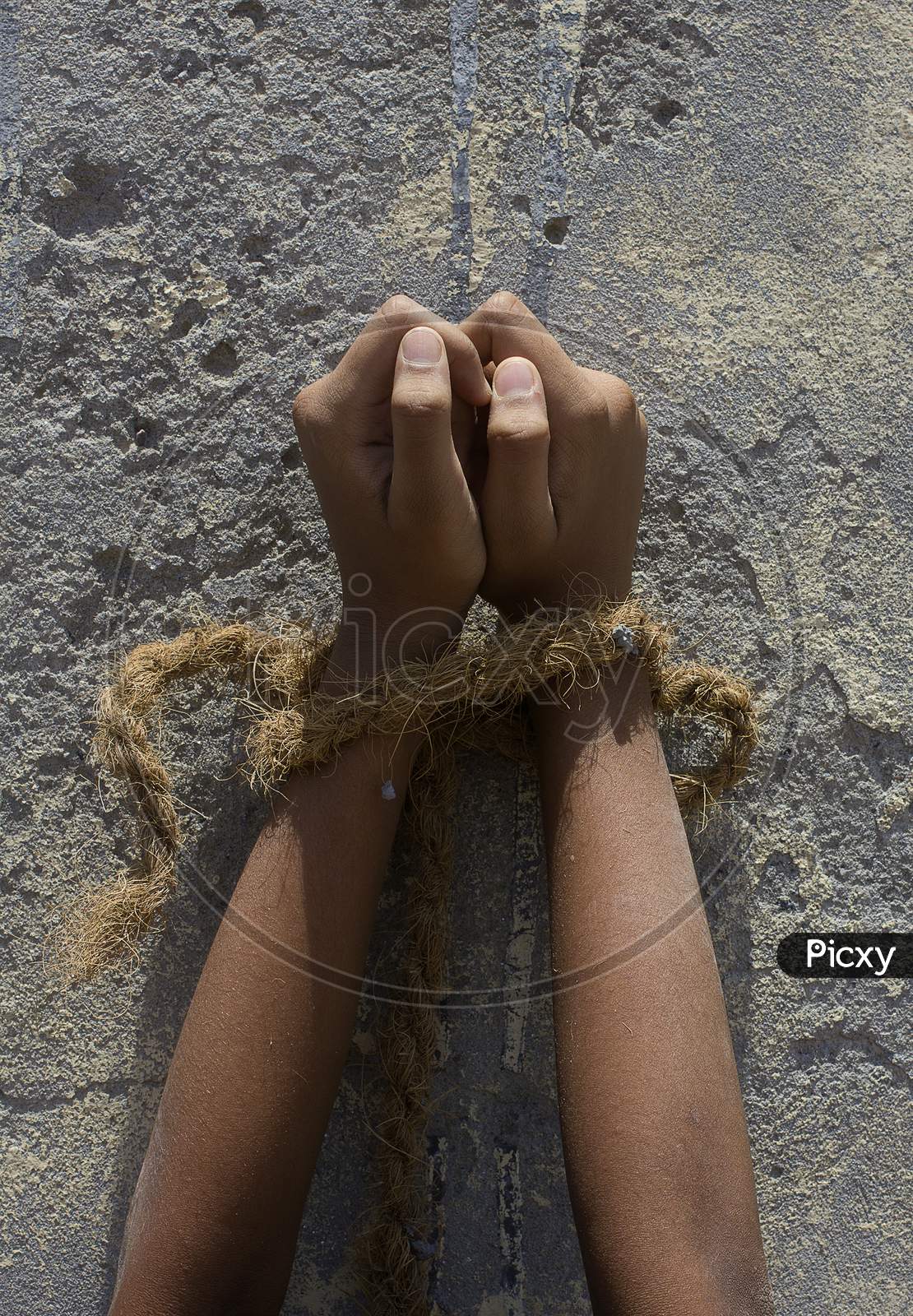 Close up shot of a kid's hands tide with a Rope