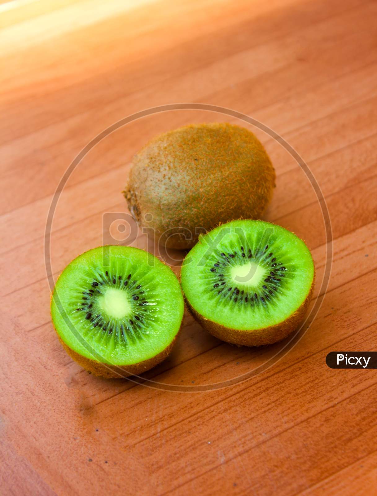 Kiwi Fruit on Wooden Background